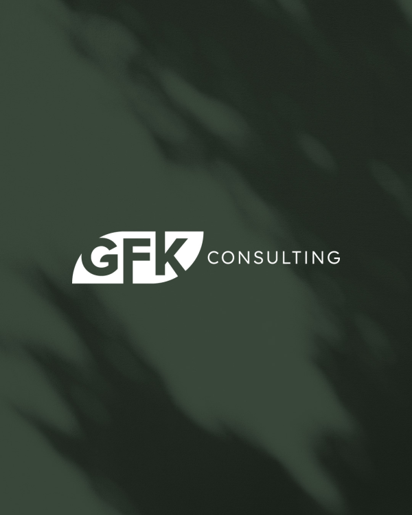 GFK Consulting logo over dark green shadowy background.